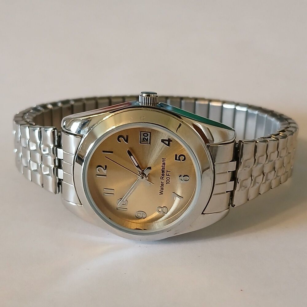 Ladies Quartz Round Silver Tone Gold Tone Date Indicator Dial Watch WR 100FT